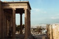 Ancient Erechtheion temple on Acropolis hill in Athens, Greece with pillars and statues, soft focus.