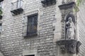 Ancient facade with sculpture, religious image, Saint Paul, by Domenec Rovira El Jove in 1668, El Raval quarter, Barcelona.