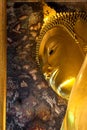 Ancient face of buddha hidden with eye contact.