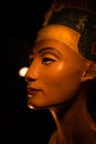 Ancient famous Egyptian bust of Queen Nefertiti around black background. close up