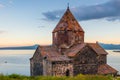 Ancient famous monastery Sevanavank at sunset, view of Lake Sevan Royalty Free Stock Photo
