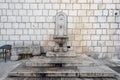 Ancient faucet fountain on street in old town Split Croatia in summer Royalty Free Stock Photo