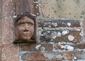 Ancient female head sculpture outside Eggesford Church in Devon, England.