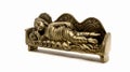 ancient figure handcrafted in gold colored metal of lord buddha sleeping Royalty Free Stock Photo