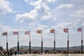 Ancient flags fluttering in the wind on background of blue cloudy sky