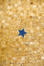Ancient floor mosaic showing a blue five pointed star. Royalty Free Stock Photo
