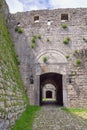 Ancient fortifications in Balkans.  Albania, Shkoder city, Rozafa Castle. Old stone wall and entrance to fortress Royalty Free Stock Photo