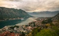 Ancient fortress on background of famous tourist town Kotor Bay mountains and sky, aerial view Montenegro Royalty Free Stock Photo