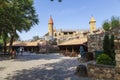 Ancient fortress or medieval castle with a clock on the tower. A place for families with children in the Logo park. Beautiful