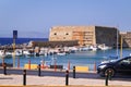 Ancient fortress at the sea port of Agios Nikolaos city, Crete island, Greece at hot summer noon. Royalty Free Stock Photo