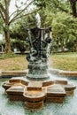 Ancient fountain with sculptures in the garden