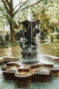 Ancient fountain with sculptures in the garden