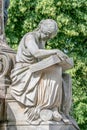 Ancient fountain statue of sensual Italian Renaissance Era woman reading a big book, Magdeburg, Germany Royalty Free Stock Photo