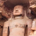 Ancient giant Jain Shri Adinatha statue carved out of rock near Gwalior fort, Madhya Pradesh, India Royalty Free Stock Photo