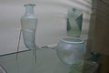 Ancient glass rithon on wire tripod stand and belly glass urn