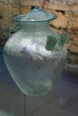 Ancient glass urn Olla Cineraria, dated to 1st or 3rd century AD, with letter H or M shaped handles