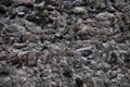 Ancient gloomy wall of gray stones, chaotic laying Royalty Free Stock Photo