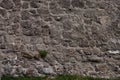 Ancient gloomy wall of gray stones, chaotic laying Royalty Free Stock Photo