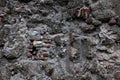 Ancient gloomy wall of gray stones, chaotic laying Royalty Free Stock Photo