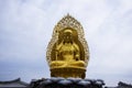 Ancient golden Jijang Bosal statue on stone rock cliffs for korean people travelers travel visit and respect praying blessing wish Royalty Free Stock Photo