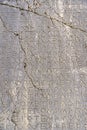 Ancient Greek antique text and inscriptions on the stone wall of the temple. Ancient Greek culture, alphabet and writing Royalty Free Stock Photo