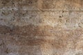 Ancient Greek antique text and inscriptions on the stone wall of the temple. Ancient Greek culture, alphabet and writing Royalty Free Stock Photo