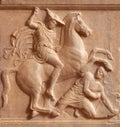 Ancient Greek bas-relief on grave stele with battle scene between a rider and a fallen hoplite in Athens, Greece