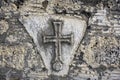 Ancient Greek Christian cross on the old stone wall of the temple Royalty Free Stock Photo