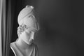 Ancient Greek goddess Athena Pallas statue on dark background with copyspace. Marble woman head in helmet sculpture