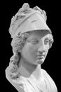 Ancient Greek goddess Athena Pallas statue isolated on black. Marble woman head in helmet sculpture. Royalty Free Stock Photo