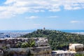 Ancient Greek ruins, ruins amidst lush green grass. Acropolis, Athens, Greece.eautiful view of the capital of Greece - Athens