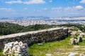 Ancient Greek ruins, ruins amidst lush green grass. Acropolis, Athens, Greece.eautiful view of the capital of Greece - Athens