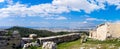 Ancient Greek ruins, ruins amidst lush green grass. Acropolis, Athens, Greece.eautiful view of the capital of Greece - Athens