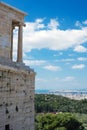 Ancient Greek ruins, ruins amidst lush green grass. Acropolis, Athens, Greece.eautiful view of the capital of Greece - Athens