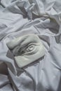 Ancient greek sculpture marble white plaster copy eye of david  against background of white drapery fabric with folds Royalty Free Stock Photo