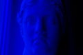 Ancient greek sculpture plaster copy marble head of diana in blue light