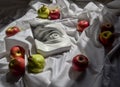 Greek sculpture white plaster copy eye of david background of white drapery with green pears and apples Royalty Free Stock Photo