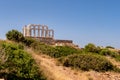 The ancient Greek Temple of Poseidon at Cape Sounion, doric columns and ruins on the hill Royalty Free Stock Photo