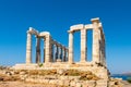 The ancient Greek Temple of Poseidon at Cape Sounion, doric columns and ruins on the hill with crystal blue sky background Royalty Free Stock Photo