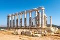 The ancient Greek Temple of Poseidon at Cape Sounion, doric columns and ruins on the hill with crystal blue sky background Royalty Free Stock Photo