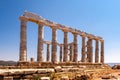 The ancient Greek Temple of Poseidon at Cape Sounion, doric columns and ruins on the hill with crystal blue sky background Royalty Free Stock Photo