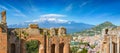 Ancient Greek theatre in Taormina on background of Etna Volcano, Italy Royalty Free Stock Photo