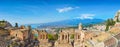 Ancient Greek theatre in Taormina on background of Etna Volcano, Italy Royalty Free Stock Photo