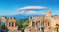 Ancient Greek Theatre In Taormina On Background Of Etna Volcano, Sicily, Italy
