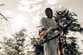 Ancient greek woman archer stands on meadow with bow and arrow Royalty Free Stock Photo