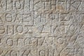 Ancient greek writing on stone in ancient city of Patara, Turkey. Close up