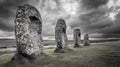 Ancient Grey Standing Stones in a Green Field under a Dramatic Cloudy Sky Royalty Free Stock Photo