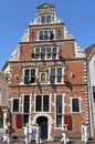 Ancient guesthouse and cheese carriers in Hoorn Royalty Free Stock Photo