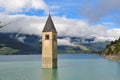 Ancient half-submerged bell tower in Graun im Vinschgau Royalty Free Stock Photo