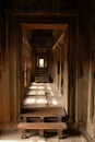 Ancient hallway and stone doorways inside Angkor Wat in Cambodia